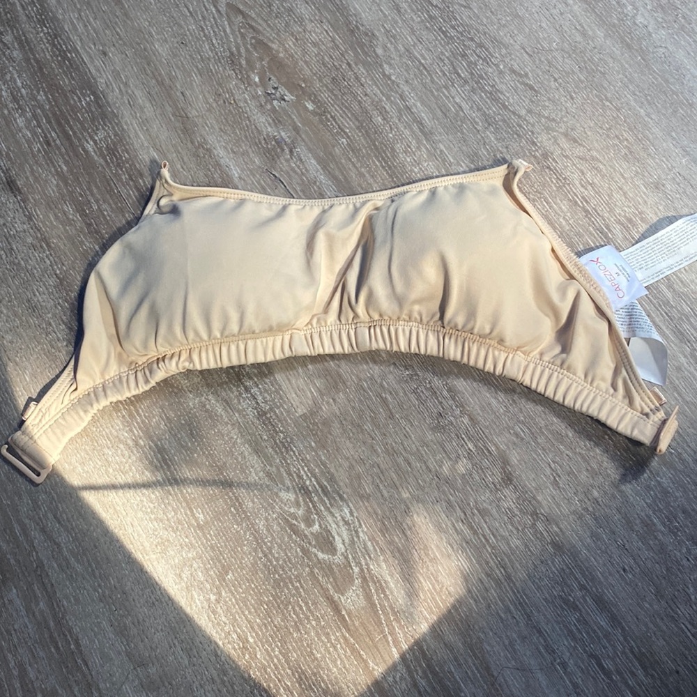 This is a “Capezio” tan bra.